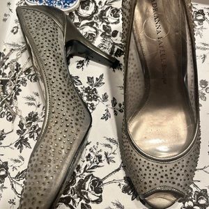 Silver/ gray gently worn Adrian papell heals. Worn once for a wedding.
